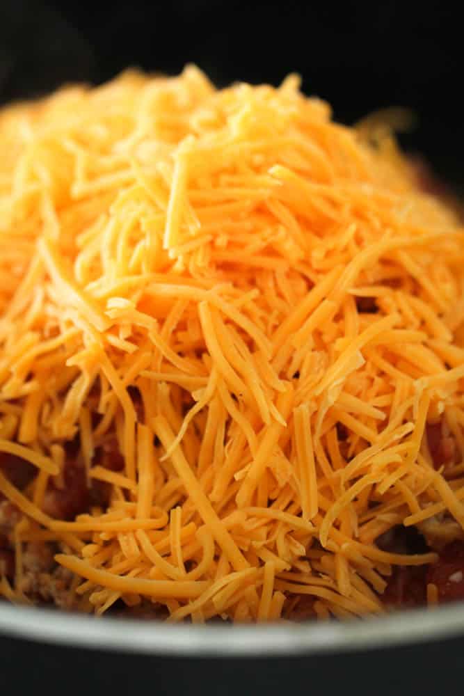 Topped mixture with shredded cheese