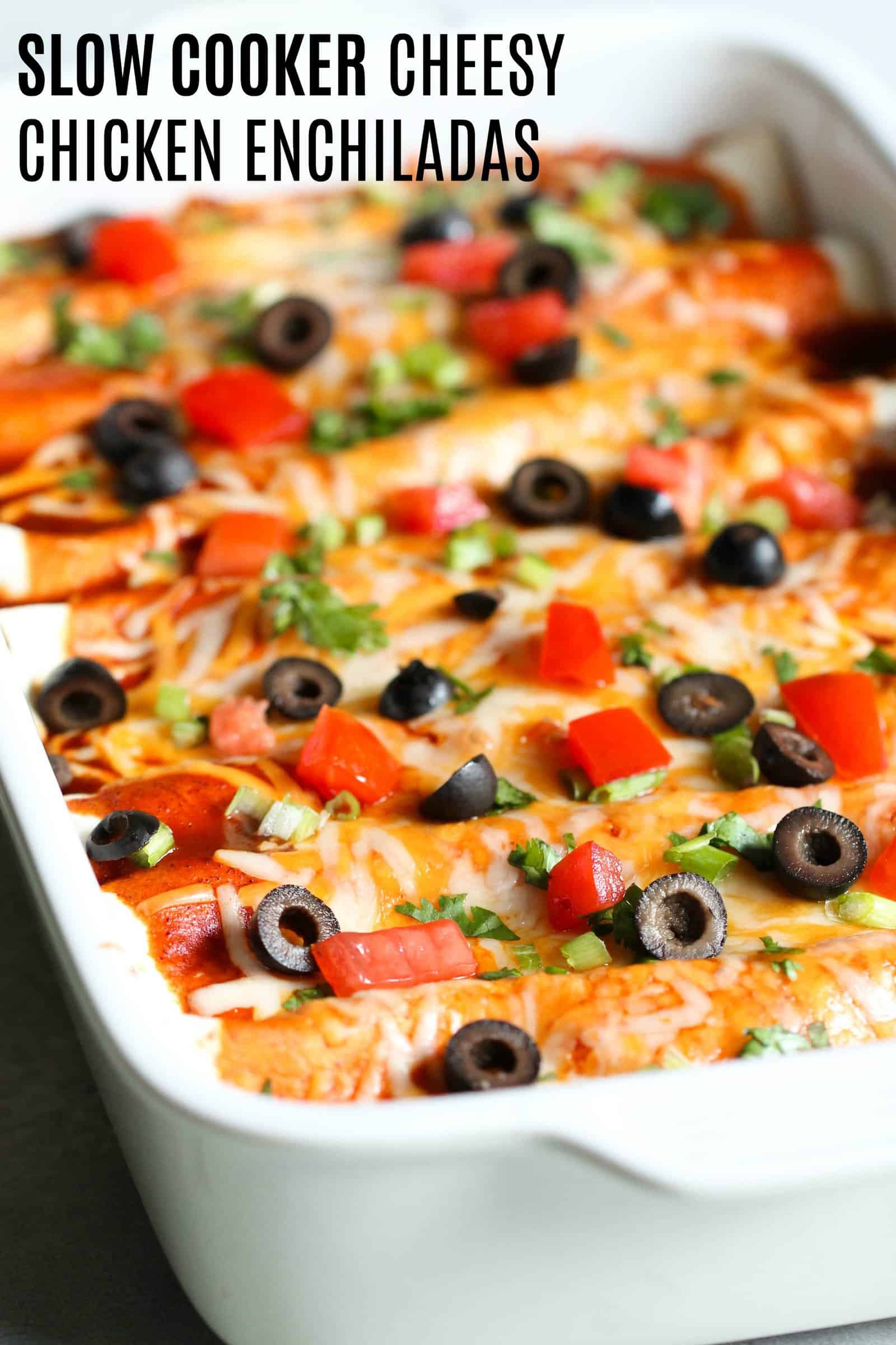 Slow Cooker Cheesy Chicken Enchiladas in a white casserole