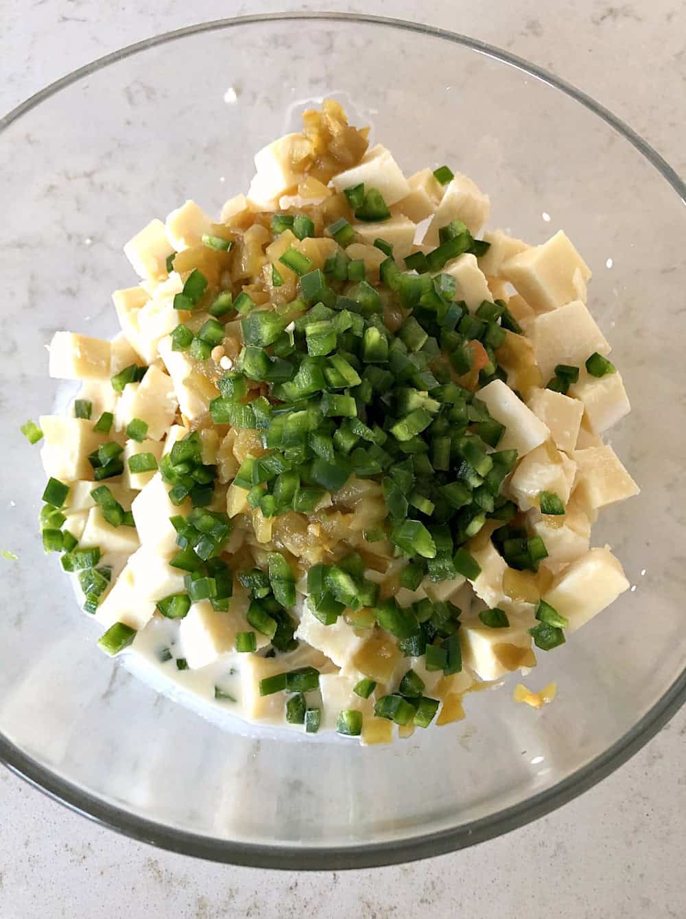 All ingredients for Queso Blanco Dip in mixing bowl