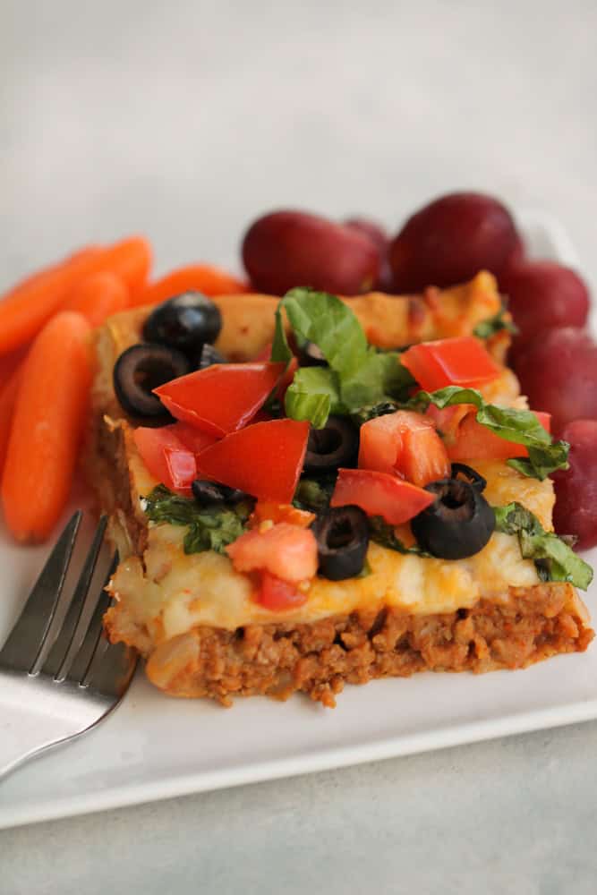 Slice of Crescent Roll Burrito Bake on a plate with a fork