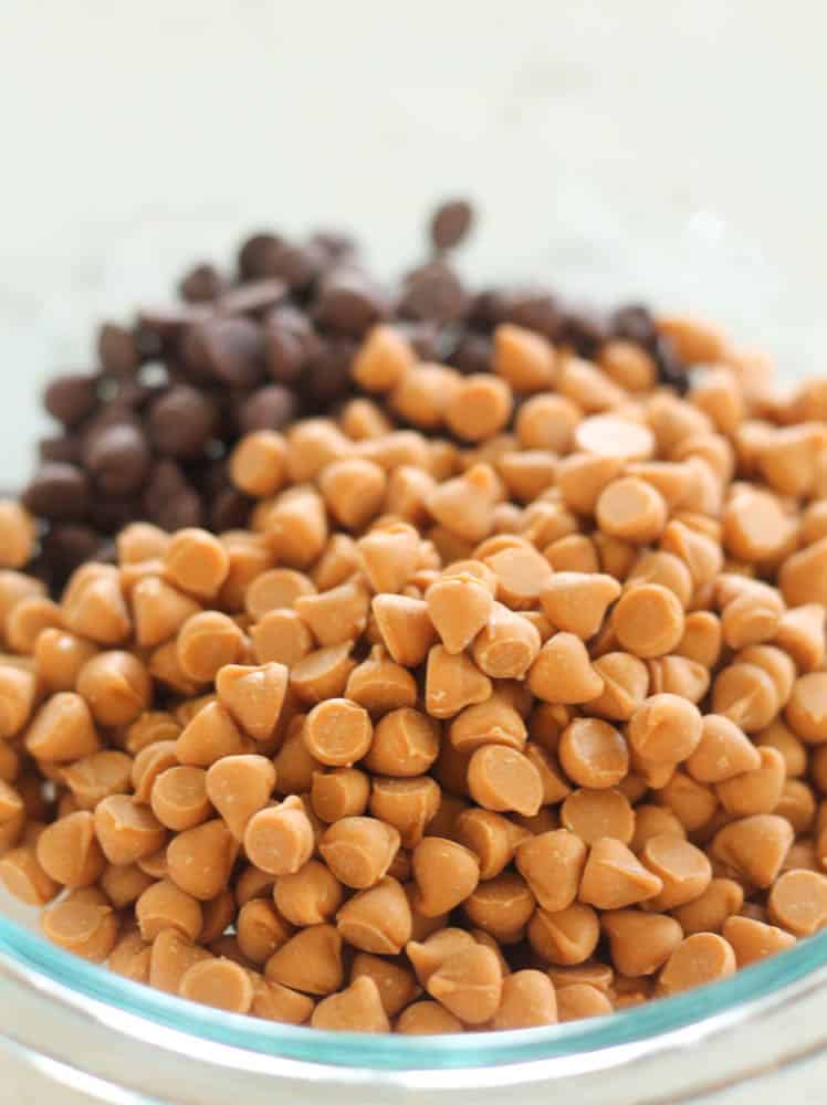 butterscotch and chocolate chips in a glass mixing bowl