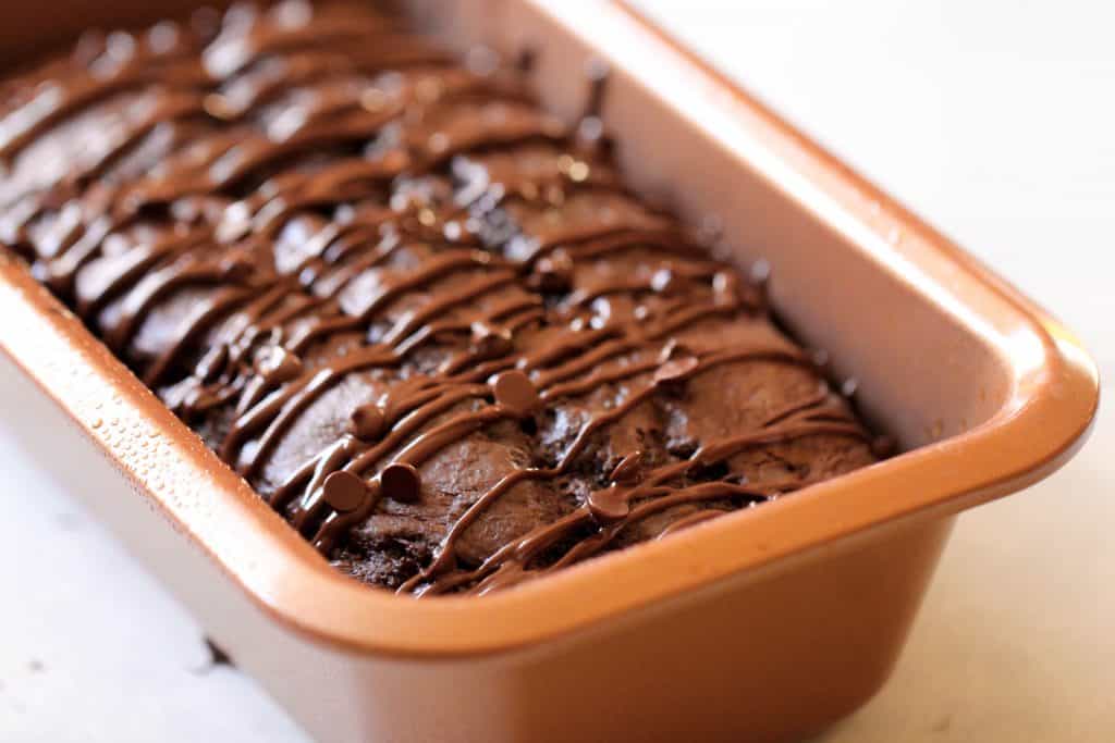 A loaf pan with Double Chocolate Pound Cake in it.