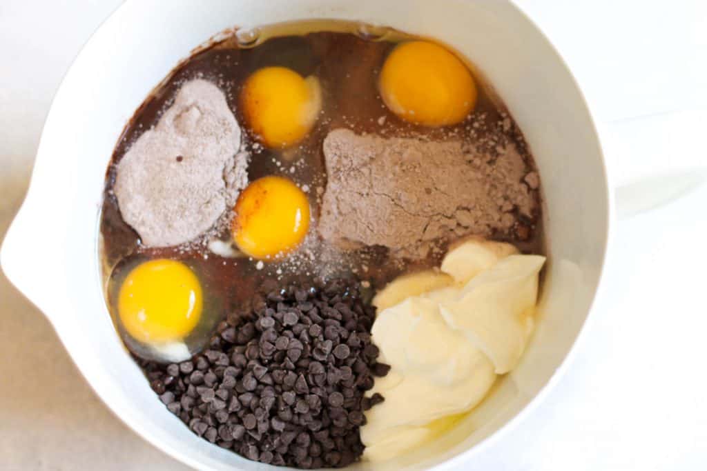 Cake ingredients together in a white mixing bowl.