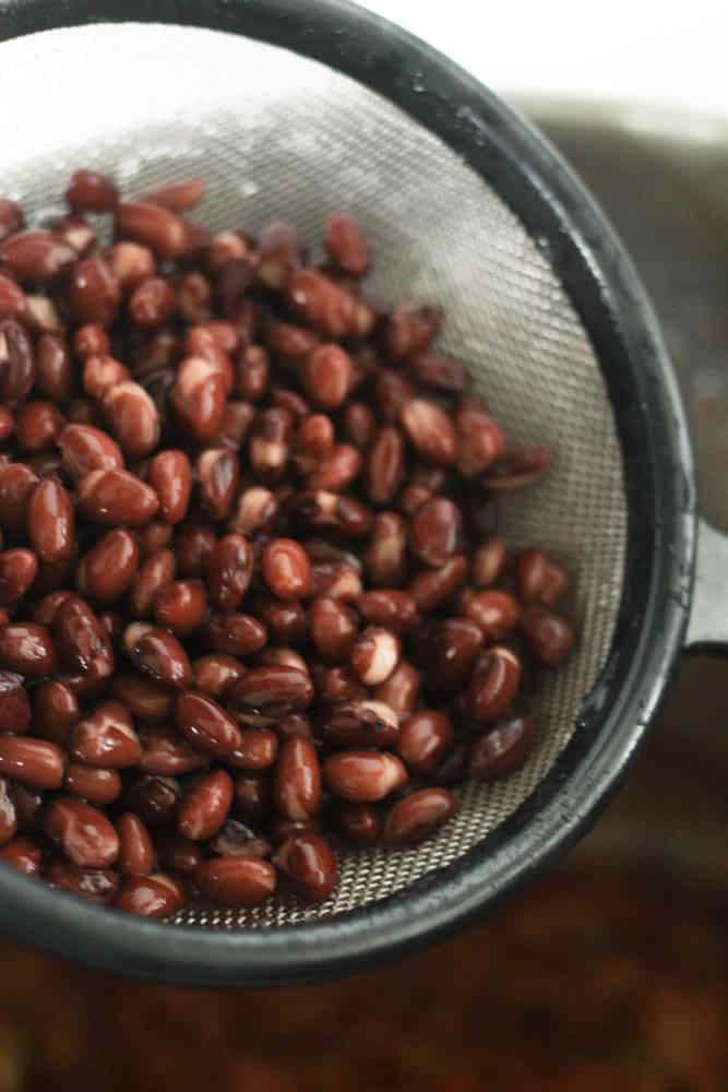 black beans in a strainer