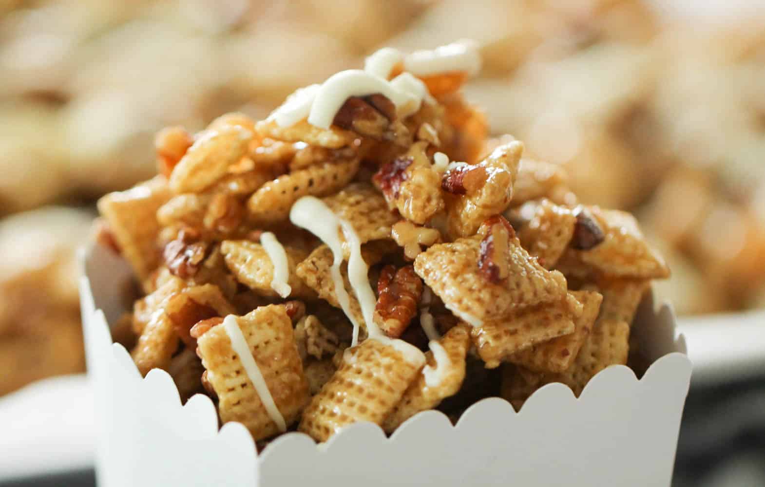 pecan pie chex mix in a white cardboard container