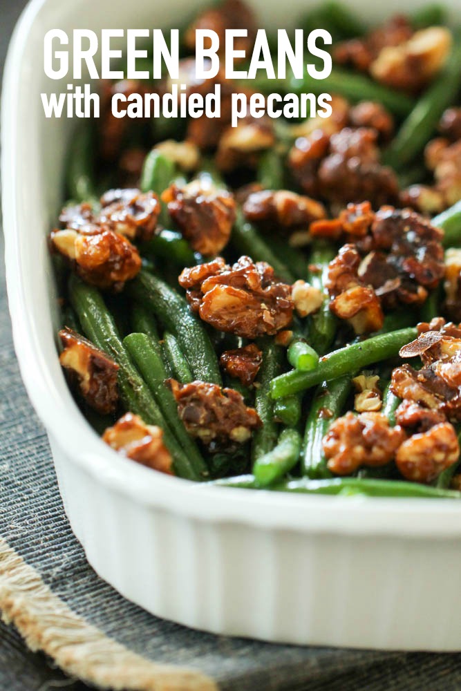 green beans with candied pecans in a white baking dish