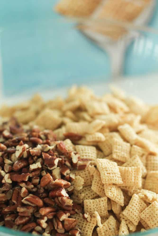 pecans and chex mix in a bowl