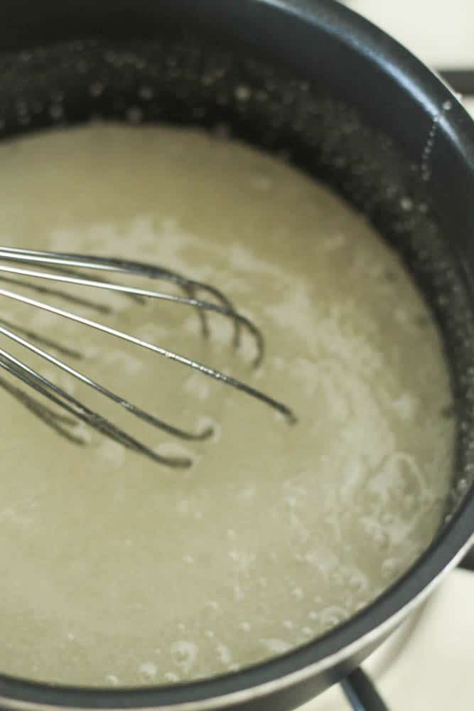 Corn syrup and sugar boiling in sauce pan