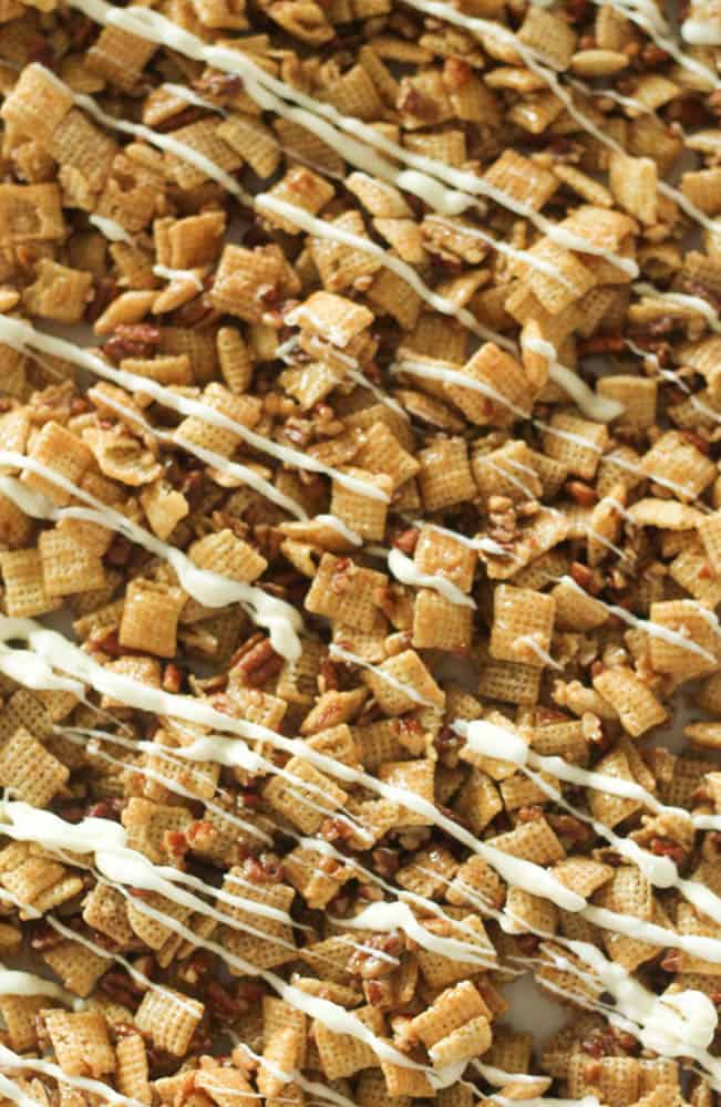 caramel chex mix with pecans and drizzled with white chocolate