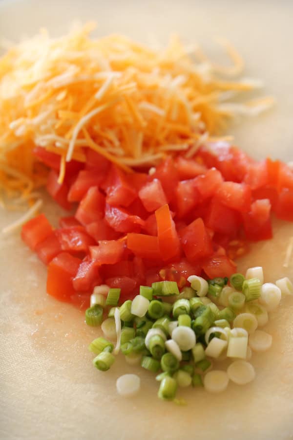 Cheese, diced tomatoes and green onions