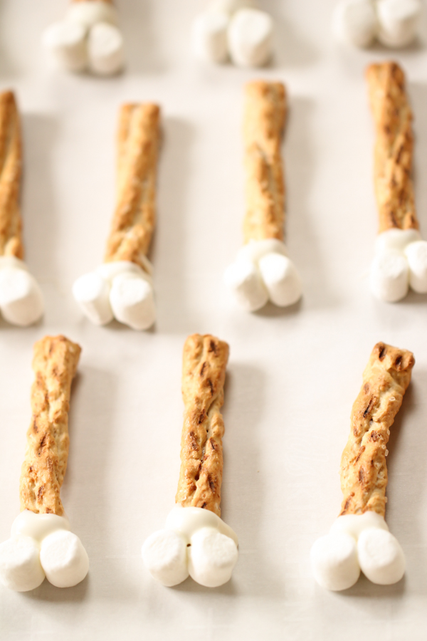 Pretzel rods with mini marshmallows on the end