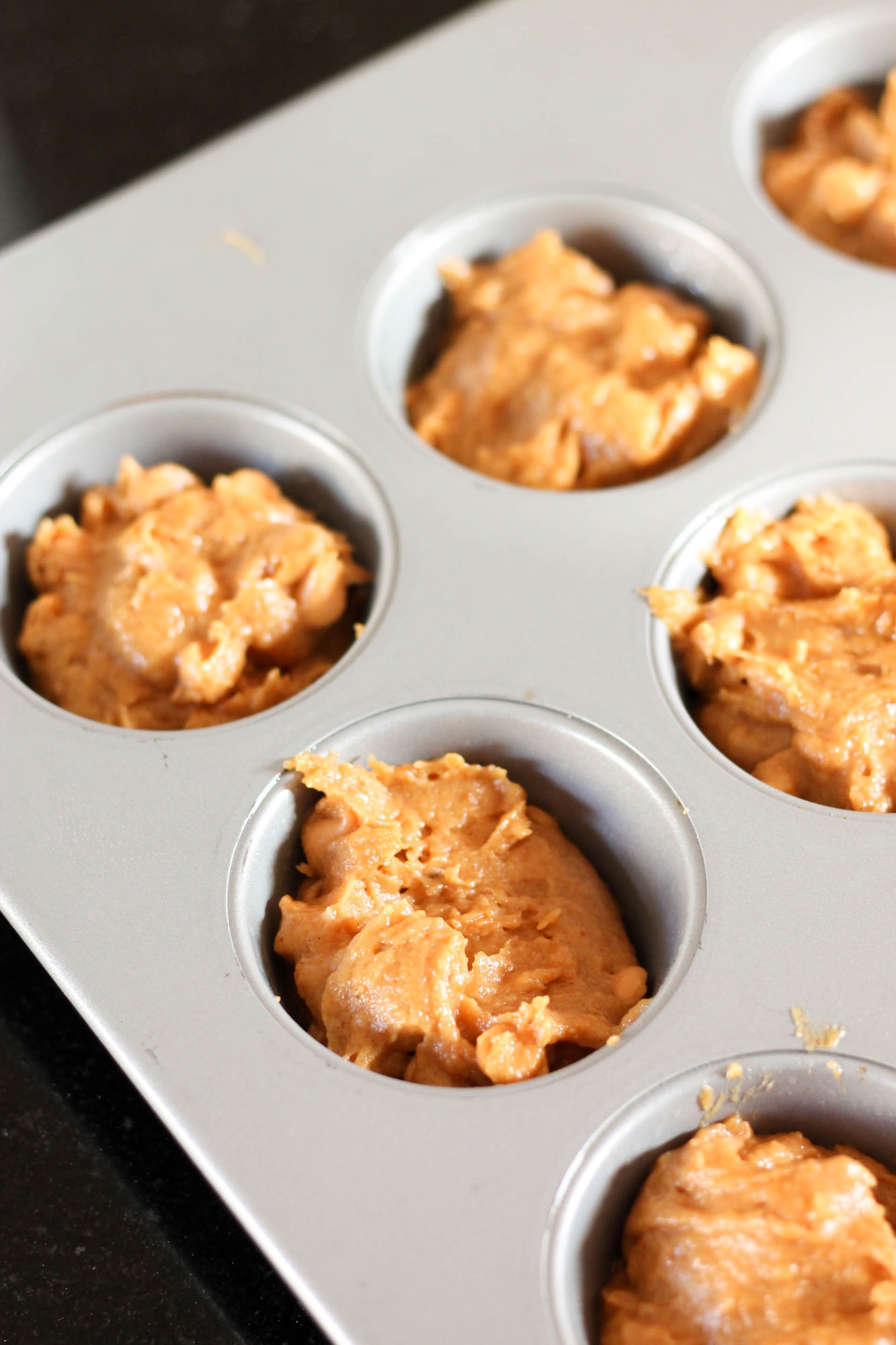 Butterscotch chips added and spooned into a muffin tin.