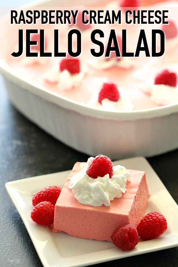 A slice of Raspberry Cream Cheese Jello Salad on a plate with fresh raspberries