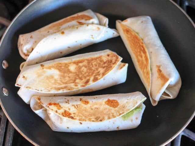 burritos cooking in pan