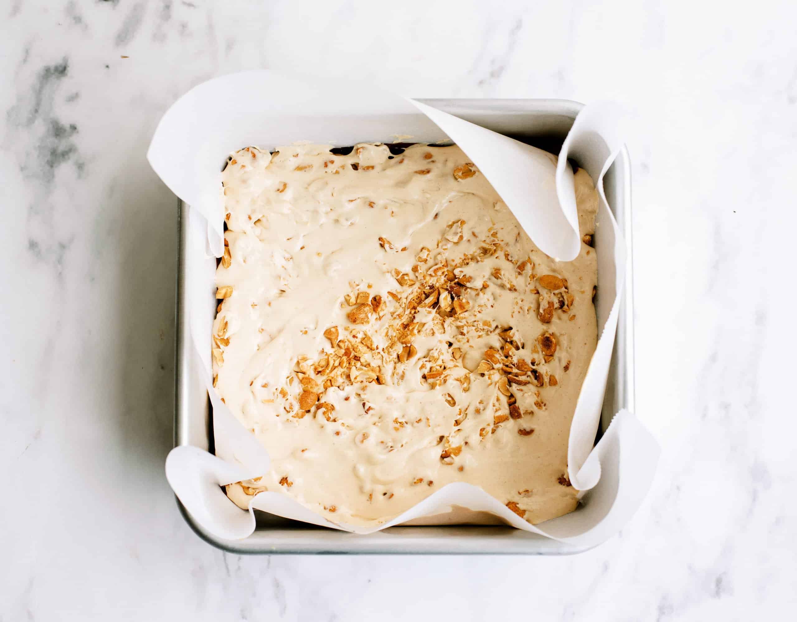 Evaporated milk mixture poured on bottom layer of fudge