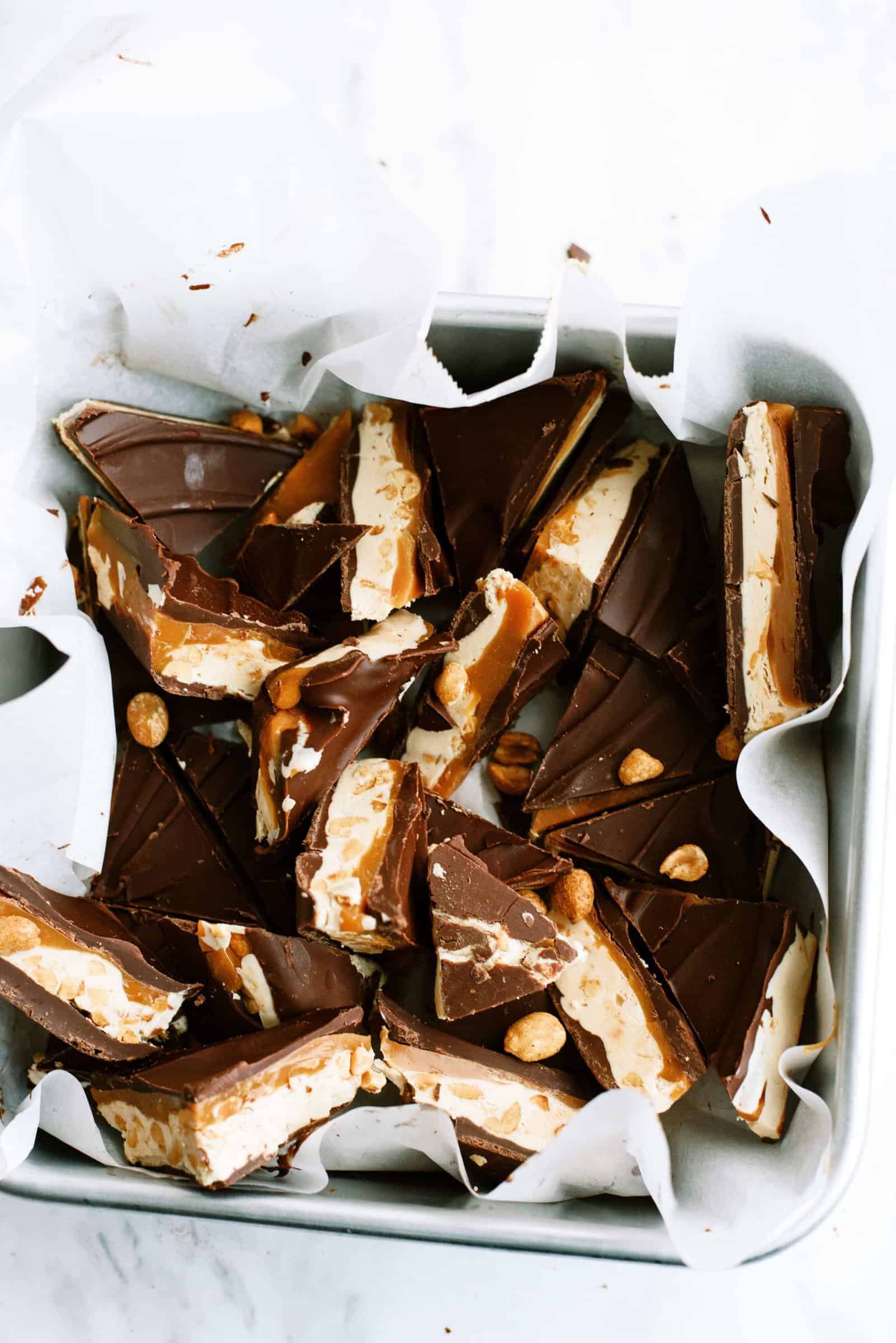 Snickers Fudge broken into pieces in pan