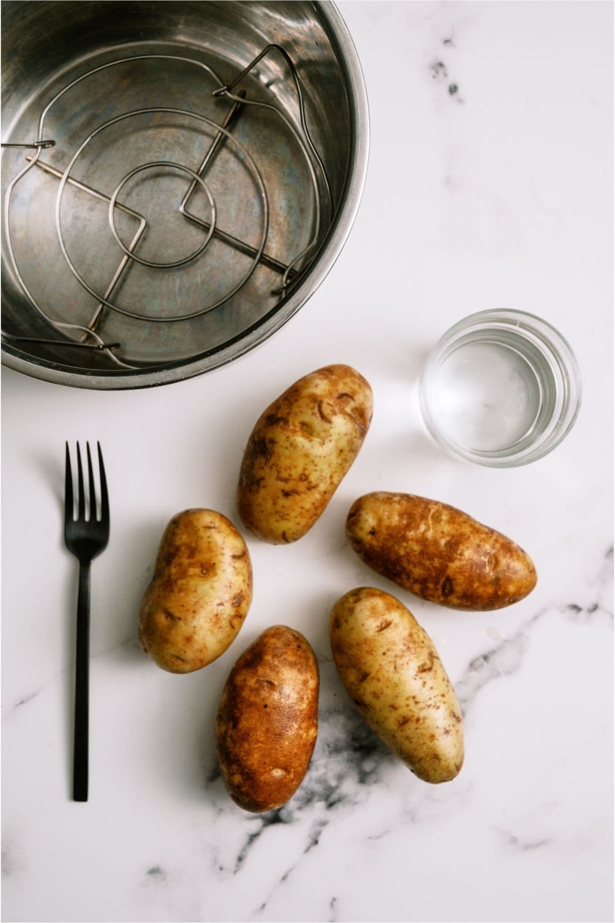 Ingredients needed to make Instant Pot Baked Potatoes.