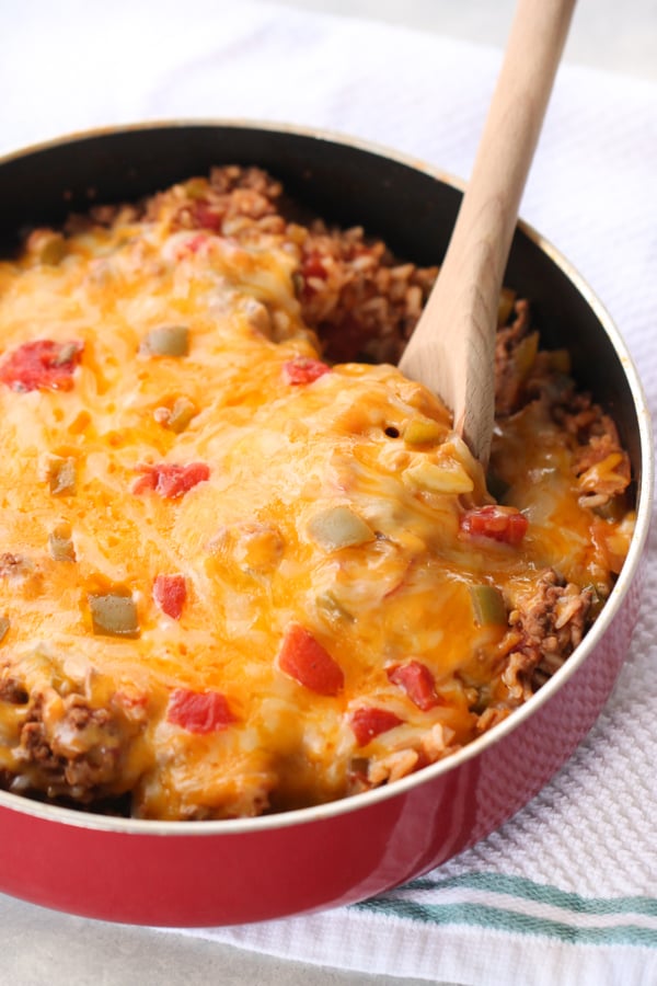 One Pan Stuffed Pepper Casserole in a pan with a wooden spoon