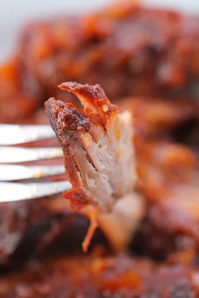 Fork with a piece of Slow Cooker BBQ Country Style Ribs
