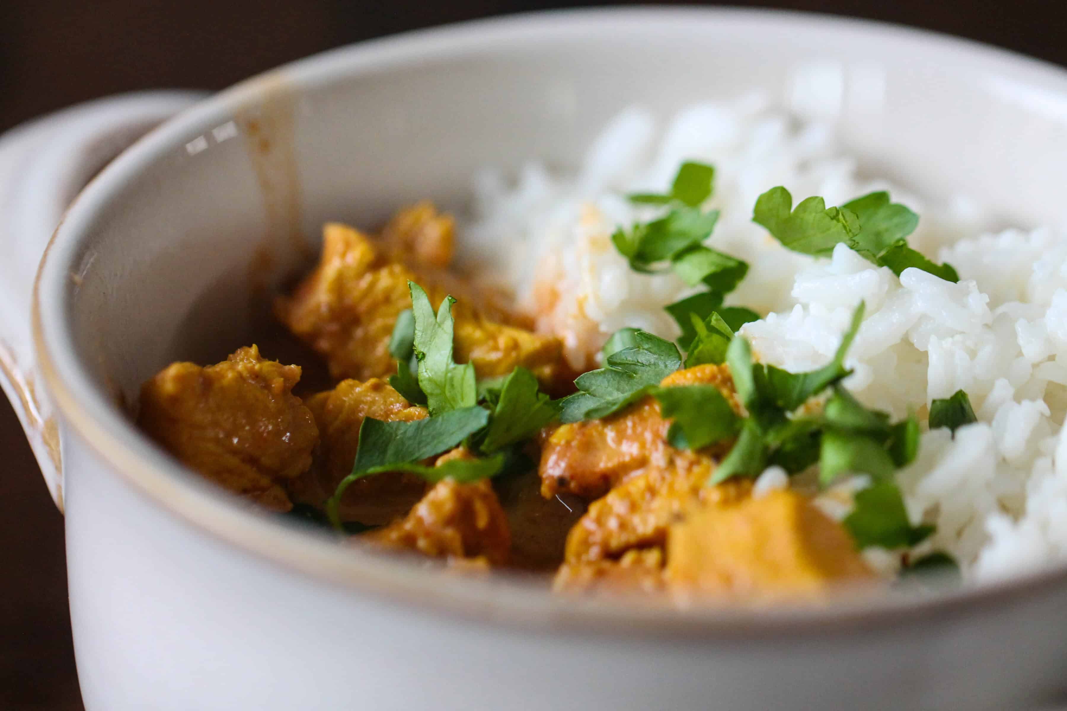 Cooked chicken tikka masala in bowl with rice