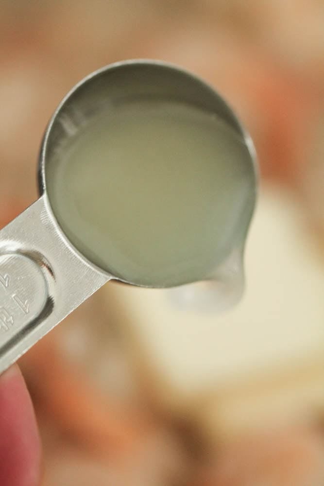 Adding lemon juice to pan