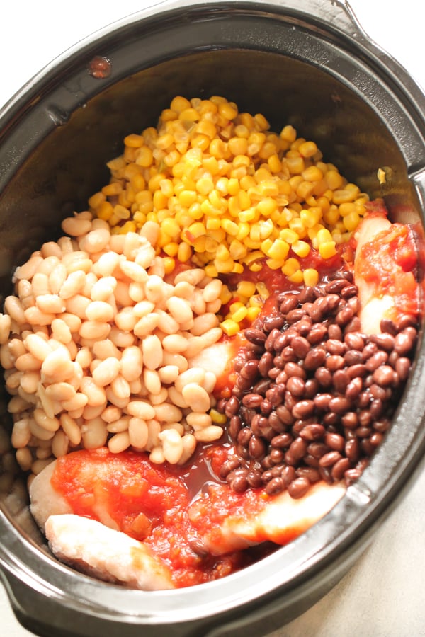 Ingredients for Slow Cooker Creamy Bean and Salsa Chicken together in the slow cooker