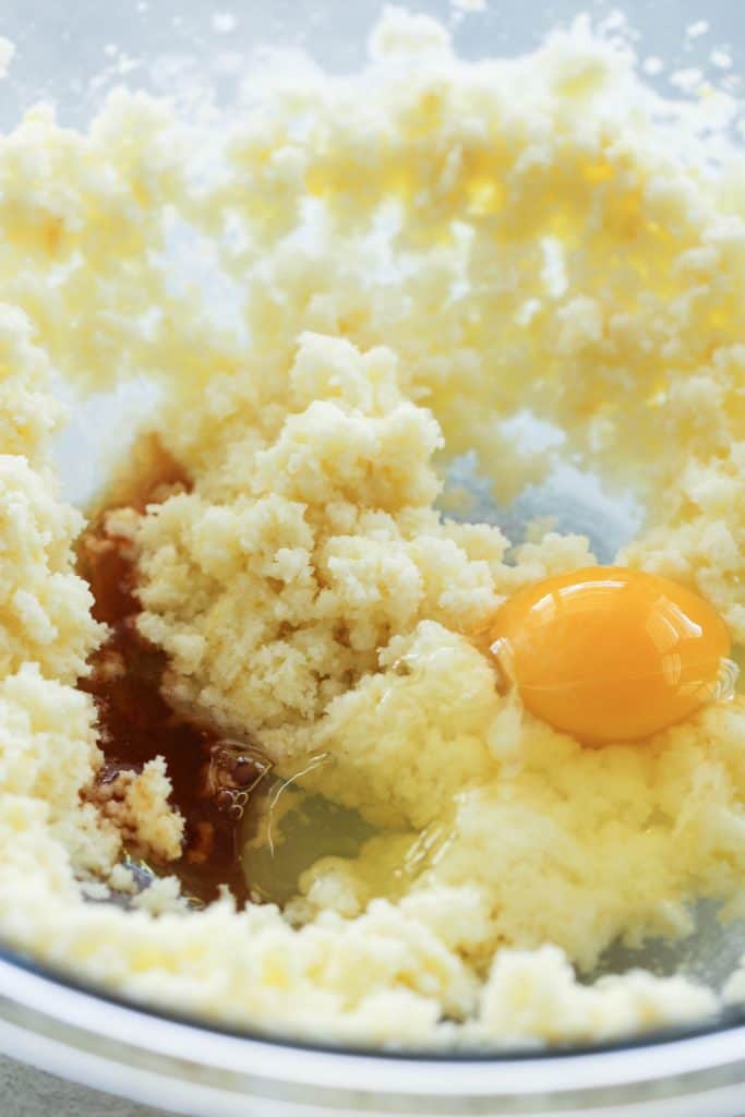 Ingredients for cake mixed together in a glass mixing bowl.