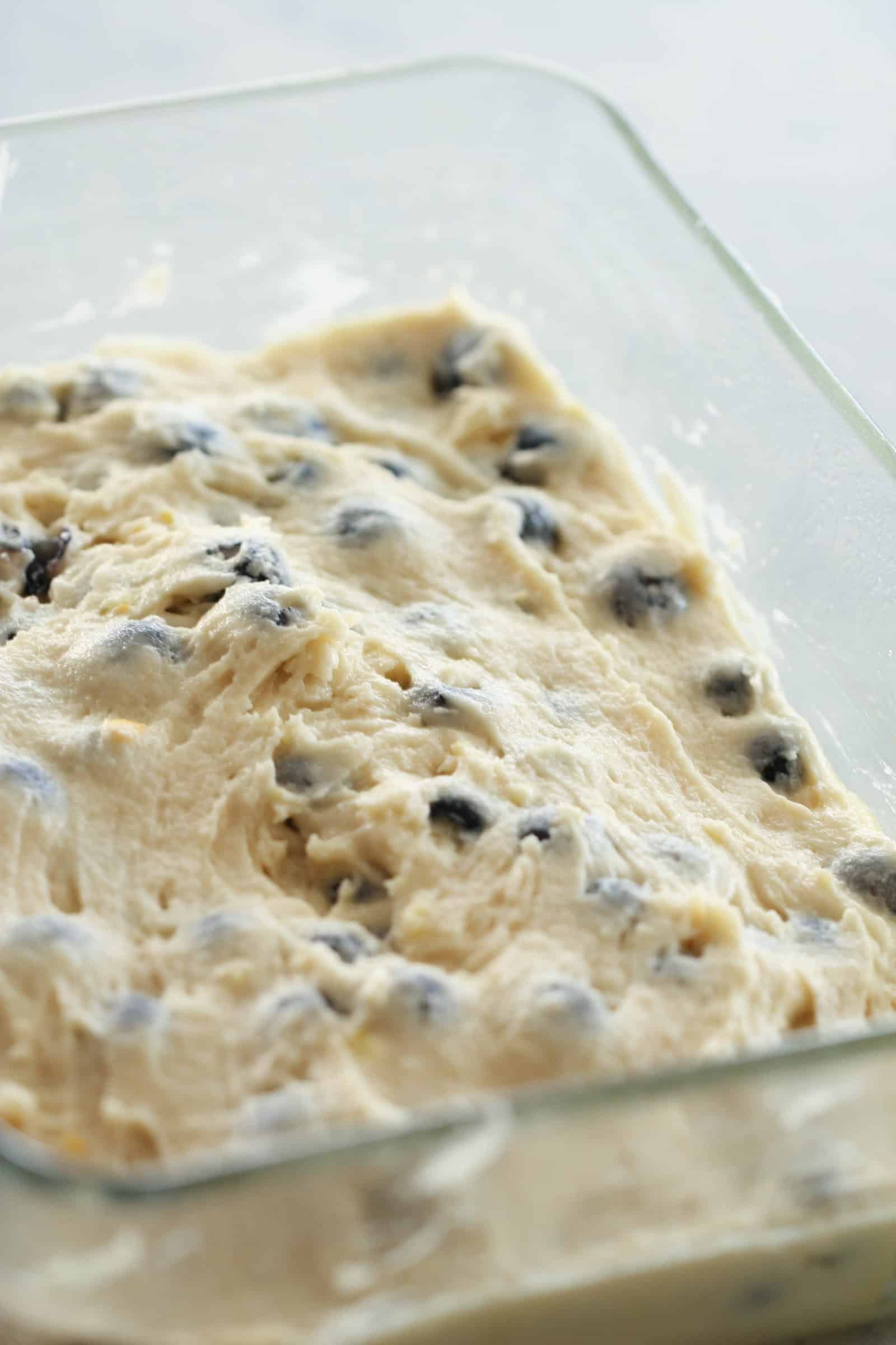 Lemon Blueberry Cake batter spread in pan.