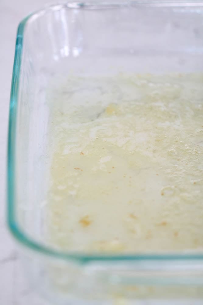 melted butter in a glass 9x13 dish