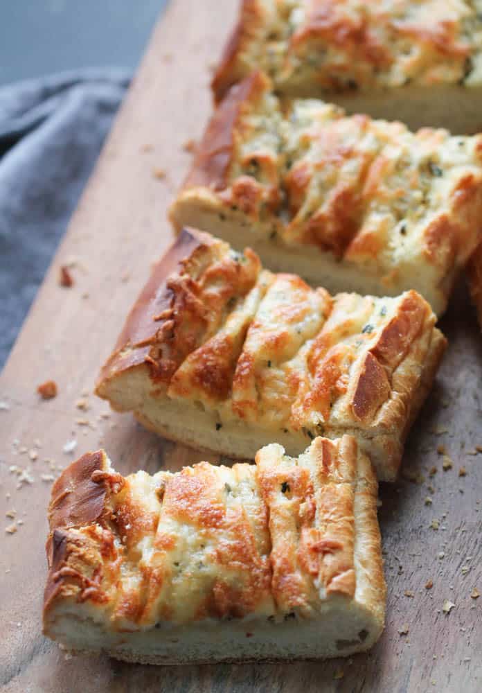 Easy Cheesy Garlic Bread sliced into squares