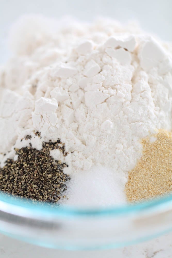 flour and seasonings in a shallow bowl