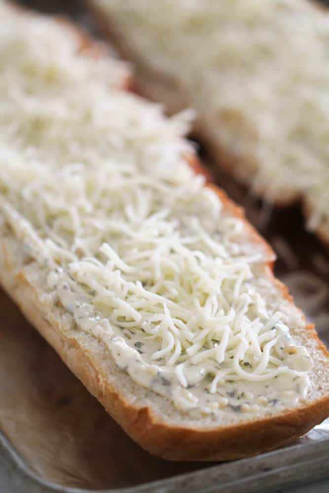 Unbaked Easy Cheesy Garlic Bread on a sheet pan