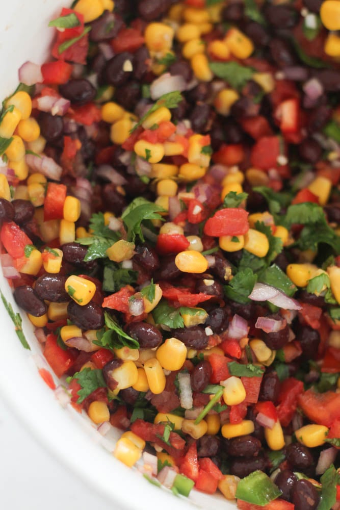 Ingredients for Black Bean and Corn Salsa mixed in a bowl