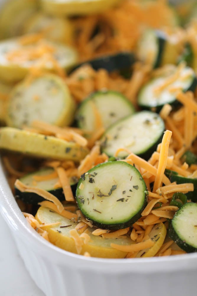 Unbaked Cheesy Zucchini and Squash Bake in casserole dish