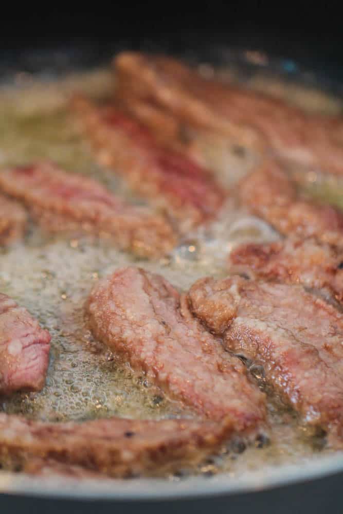 Copycat P.F. Chang's Mongolian Beef in saute pan cooking