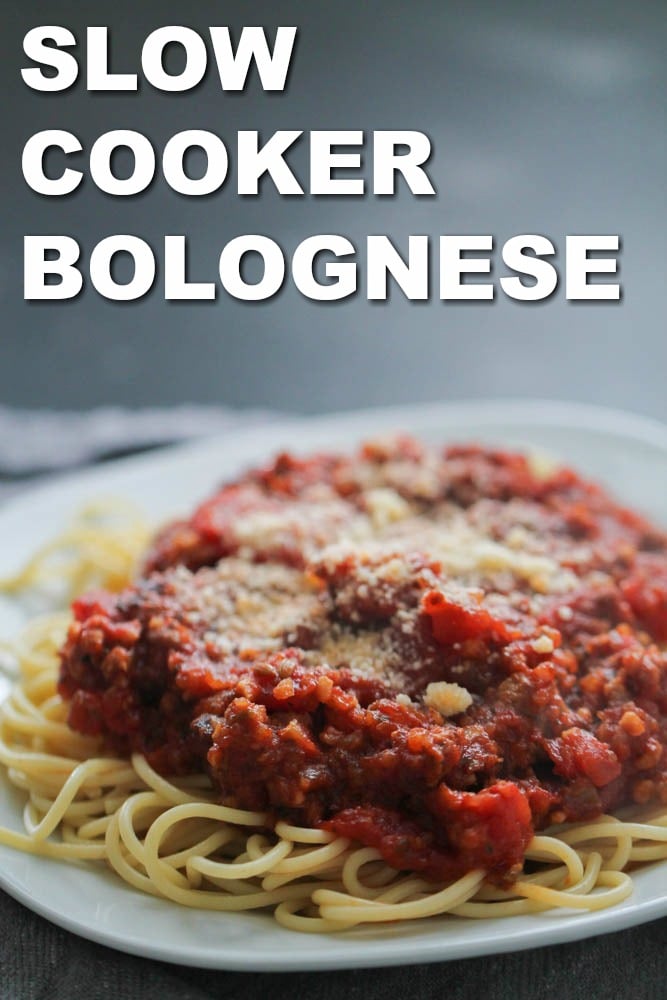 Slow Cooker Bolognese on top of Spaghetti on a plate