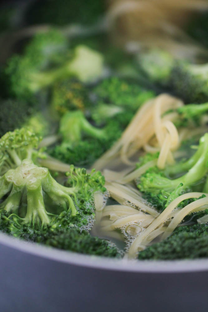 Broccoli and pasta in a pan of boiling water