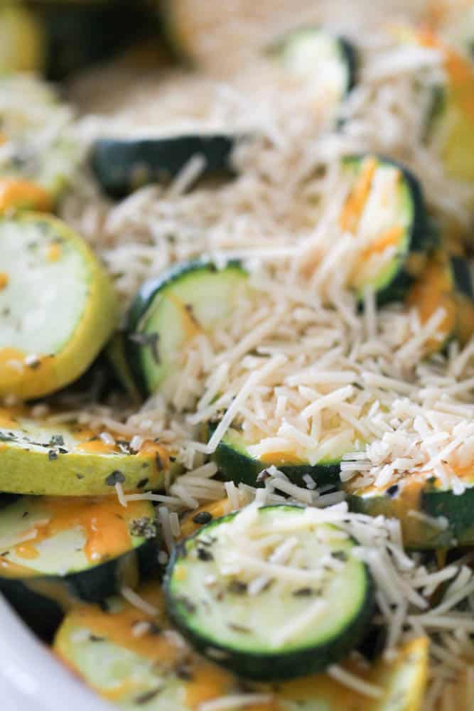 Sprinkled parmesan cheese on Cheesy Zucchini and Squash Bake