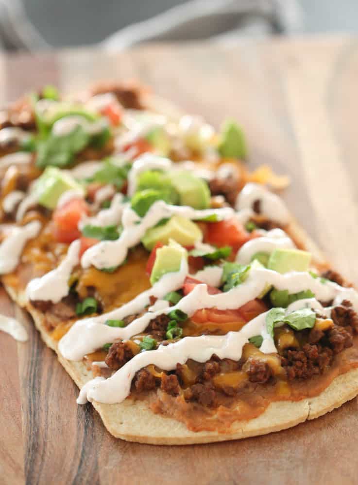 Flatbread Mexican Pizza on a serving platter, baked and ready to eat