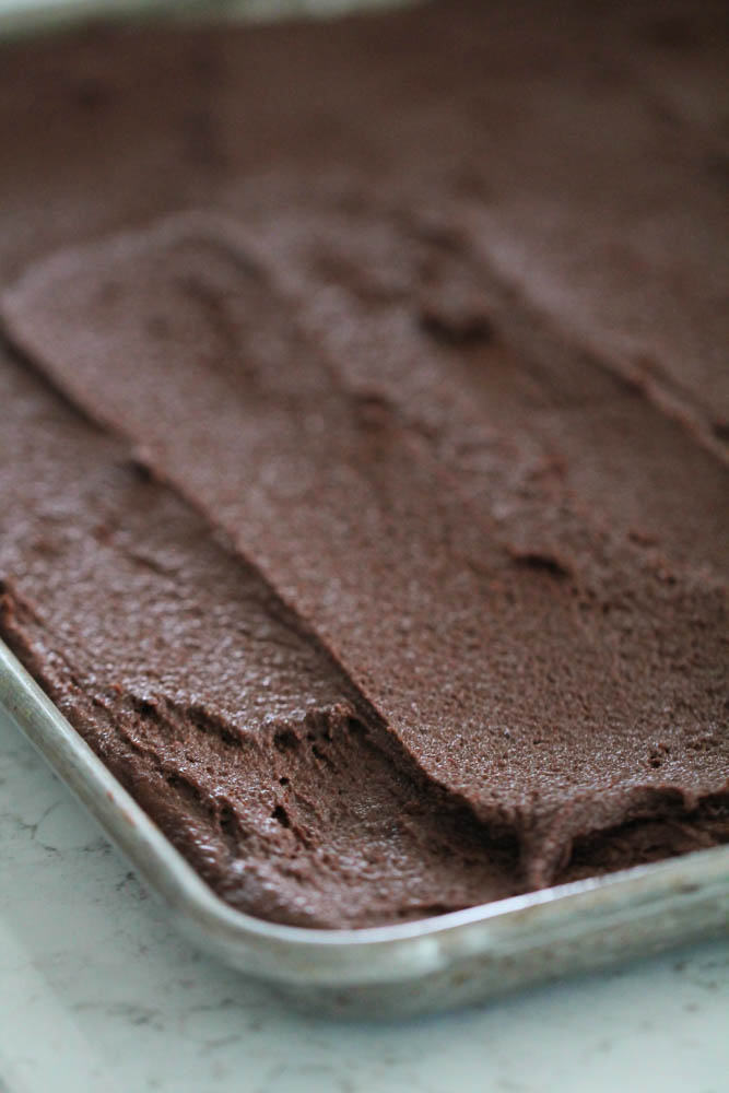 Brownie Batter spread out in sheet pan