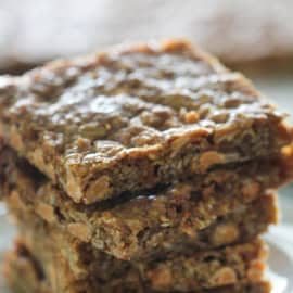 4 Sheet Pan Oatmeal Butterscotch Bars stacked on a plate.