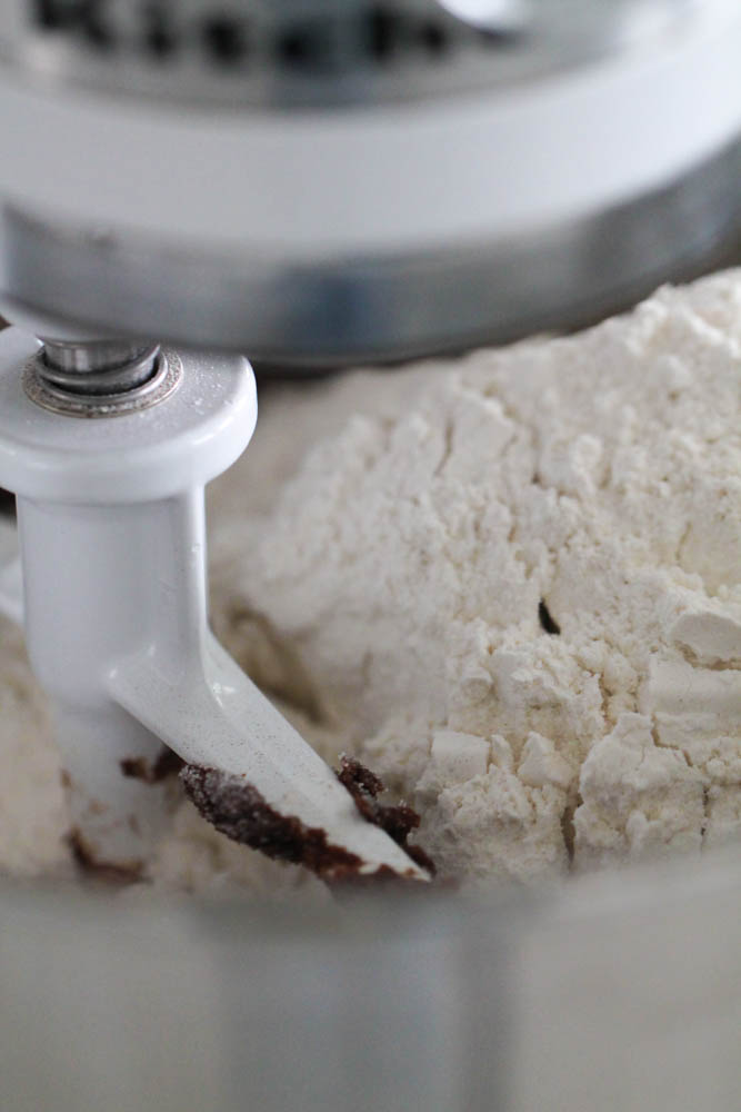 Adding flour to dough mixture