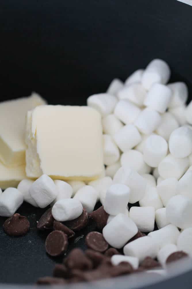 Bowl with chocolate chips, marshmallows and butter