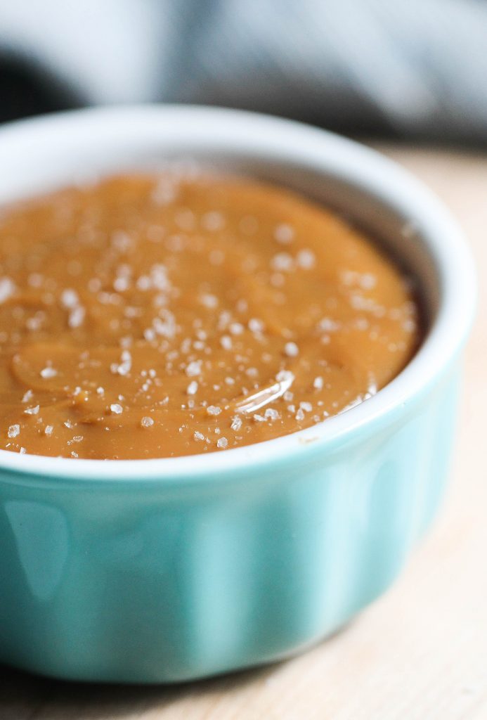 homemade dulce de leche in  bowl with salt on top