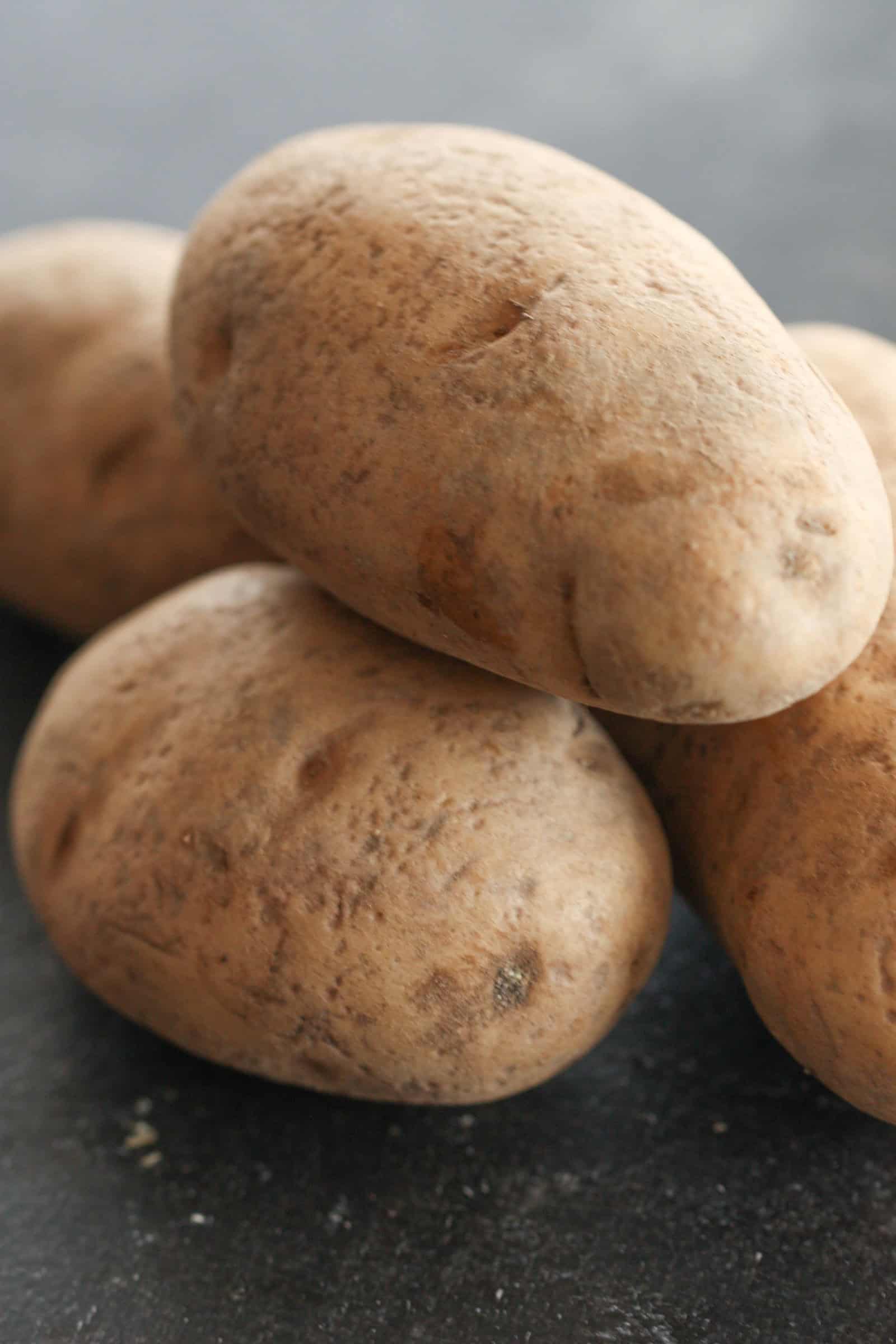 russet potatoes stacked in a pile