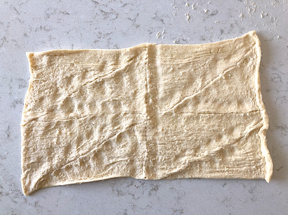 Crescent roll dough rolled out into a rectangle