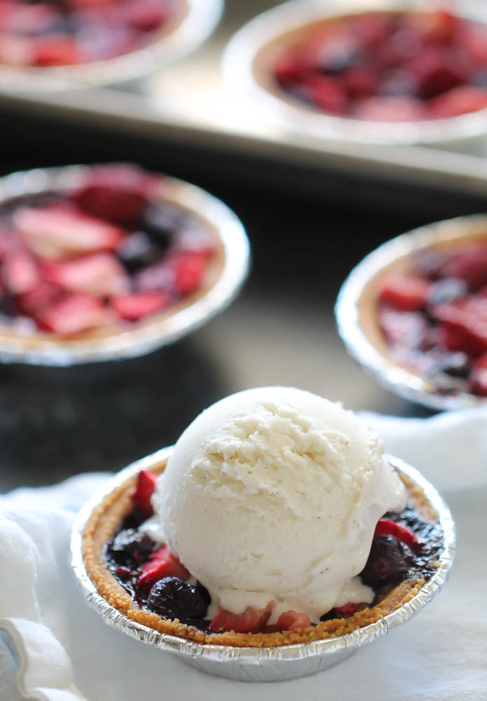 Baked Mini Berry Pie with a scoop of Ice Cream on top