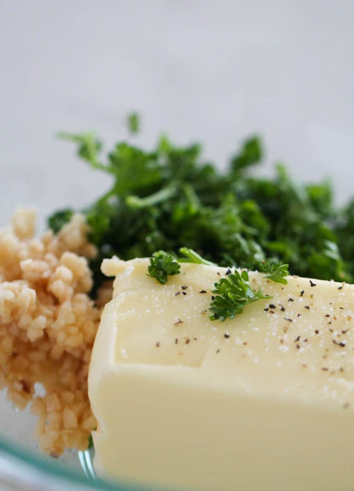 butter, parsley and garlic in a bowl together