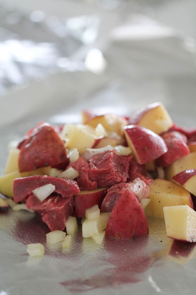 steak and potato mixture on foil