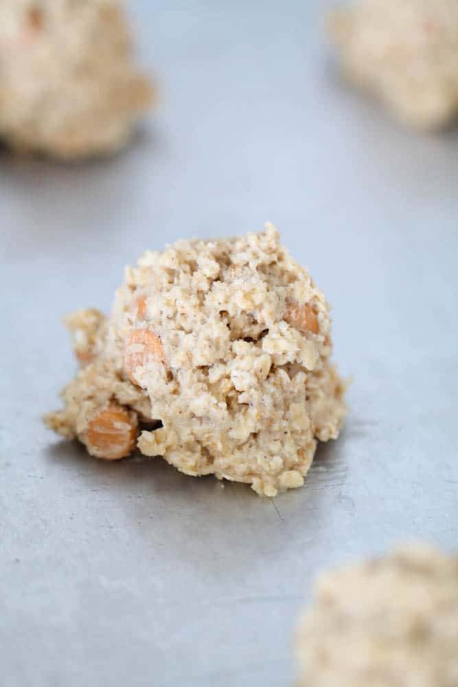 Oatmeal Scotchies Cookie dough balls on a baking sheet.